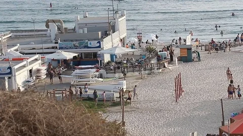 Israel Tel Aviv Beach Time lapse of people walking on the beach in a sunny day Stock Footage 78607289