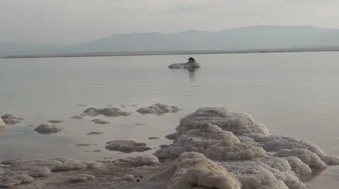 Israel.Dead Sea.Chunks of salt on the surface of the Dead Sea. Stockbeeldmateriaal 68454675
