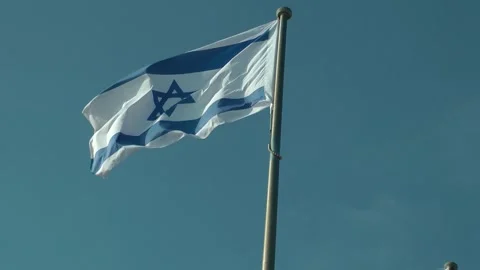 An Israeli flag is flying 動画素材 343388299