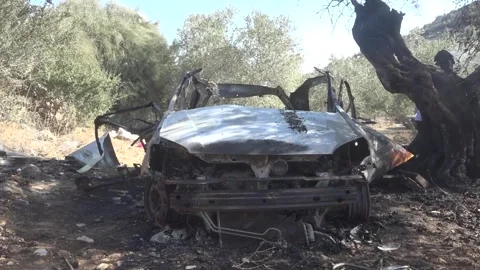 Israeli forces target vehicle during raid in occupied West Bank Stock Footage 320631604