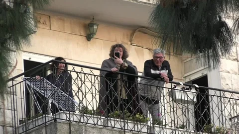 Israelis watching protests from balcony Video stock 237083579