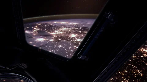 ISS Window View of Glowing Earth City Lights During Night Orbit - 4K Stock Footage 321490933