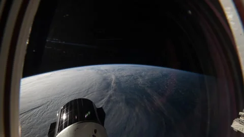 ISS Window View SpaceX Dragon Module Earth Clouds Dark Space. Stock Footage 331036317