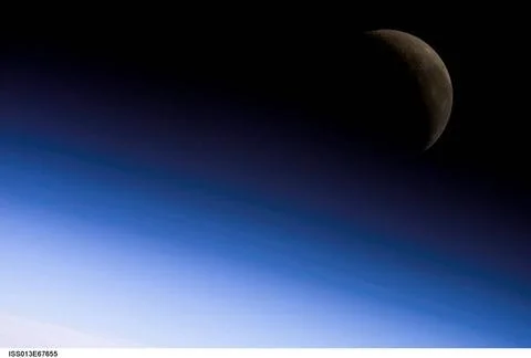ISS013-E-67655 (18 Aug. 2006) --- A crescent moon is visible in this view ... Fotos Stock