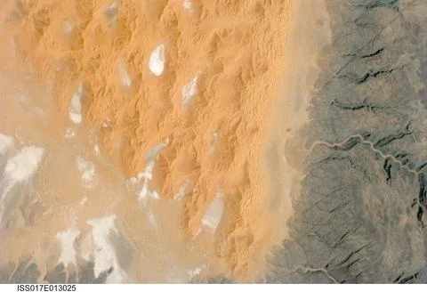 ISS017-E-013025 (12 Aug. 2008) --- The Tifernine Dune Field in Algeria is f.. Stock Photos