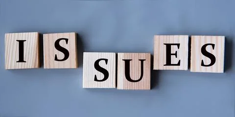 ISSUES - word on wooden cubes on a gray background Stock Photos