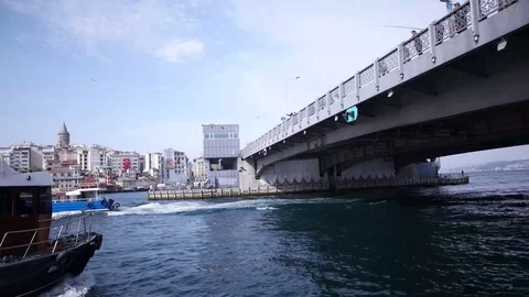 ISTANBUL - MAY, 2017: View of Bosphorus, boats and ferry passing under bridge Stock-Footage 76097515