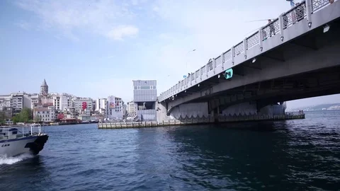 ISTANBUL - MAY, 2017: View of Bosphorus, boats and ferry passing under bridge Stock Footage 76098385