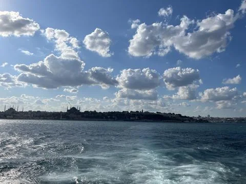 Istanbul Skyline from the Sea with Dramatic Clouds and Blue Sky Stock Photos