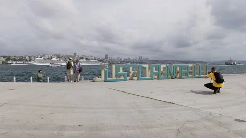 Istanbul, Turkey - August 8, 2025: Tourists taking photos at sign on bosphorus Stock-Footage 337554530