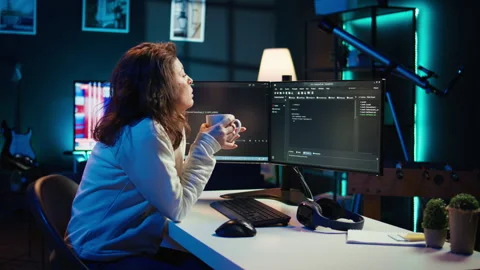IT admin enjoying hot beverage while increasing data security Stock Footage 283595387