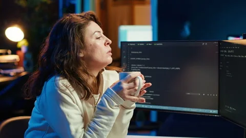 IT admin enjoying hot beverage while increasing data security Stock Footage 283692979