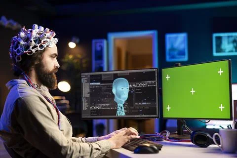 IT admin using high tech neuroscientific gear and mockup computer Stock Photos