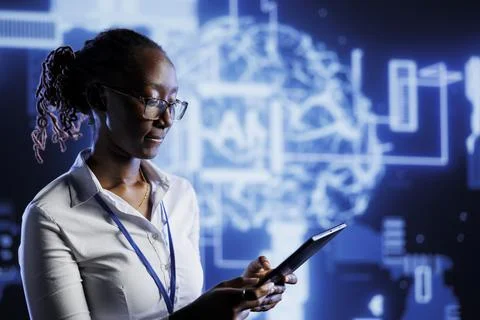 IT admin writes AI code on laptop Foto stock