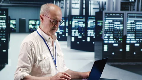 IT administrator optimizes data center Stock Footage 249968735