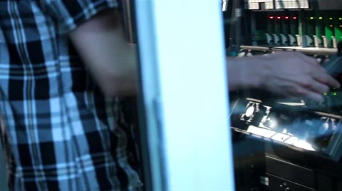 IT administrator or TV engineer installing electric board rack mount server Stock Footage 47857193