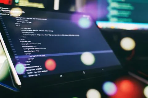 IT business.Monitor closeup of function source code. Project managers work ne Stock Photos