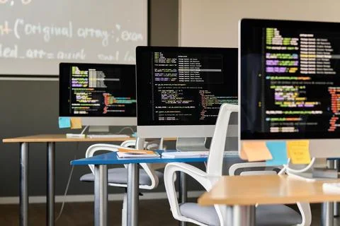 IT Class with Computers in Row Stock Photos