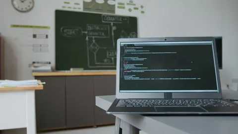 IT Classroom with Chalkboard with Flowchart and Laptop Displaying Code Stock Footage 317634600