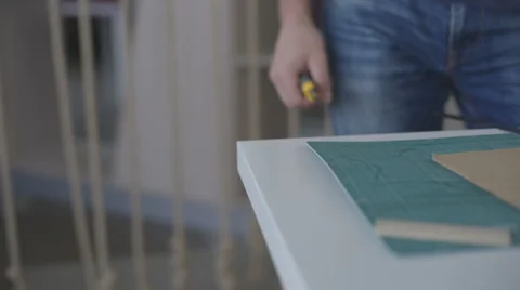 It is close-up image of man cutting paper with stationary knife Stock Footage 66331102