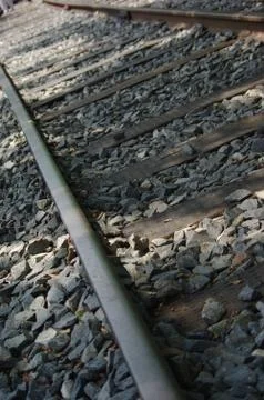 It is a close up of train rail Stock Photos