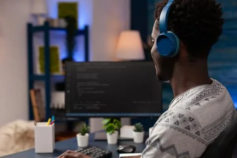 It code developer wearing headset programming codes for firewall server Foto stock