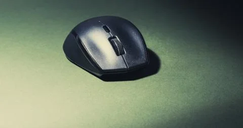 IT computer mouse on an olive green background Stock Photos