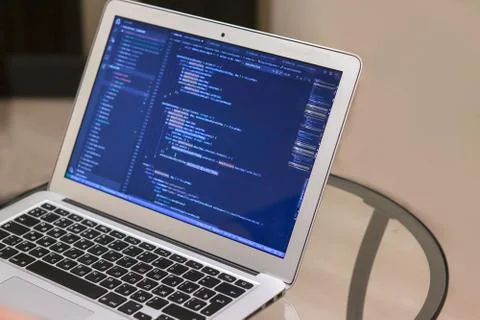 IT concept. Laptop with code or script software. Application development. Pro Stock Photos