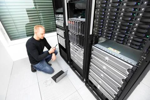 IT consultant calling for help in datacenter 스톡 사진
