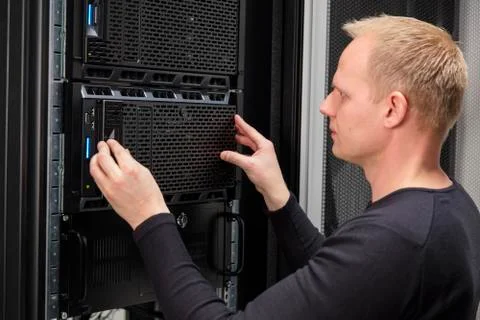 It consultant installing server in datacenter Stock Photos