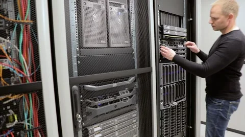 IT consultant maintain rack server in datacenter Stock Footage 66441780