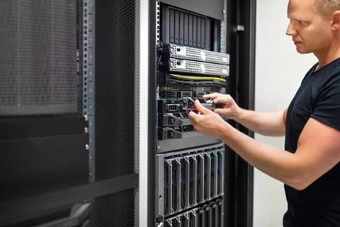 IT Consultant Monitors Servers In Data Center Stock Photos