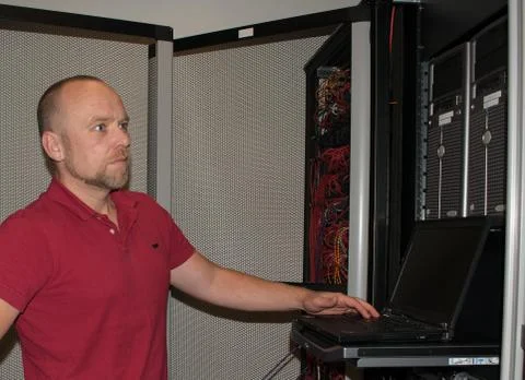 IT consultant performs work in a data center Stock Photos