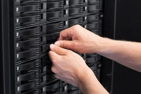 It consultant replace hard drive in san Stock Photos