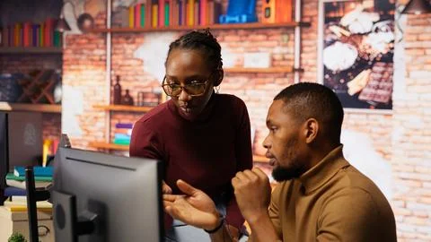 IT coworkers programming in AI startup office Stock Photos