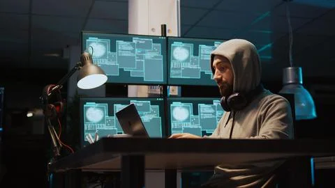 IT criminal hacking system at night using virus 写真素材