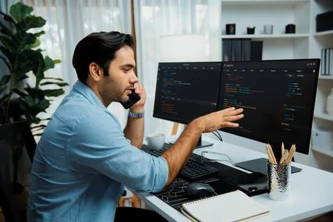 IT developer calling to coworker solving problem coding system on pc. Surmise. Stock Photos