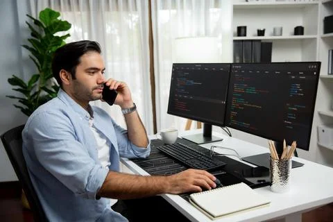 IT developer calling to coworker solving problem coding system on pc. Surmise. Stock Photos