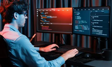 IT developer creating online software information coding on pc screen. Gusher. Foto stock