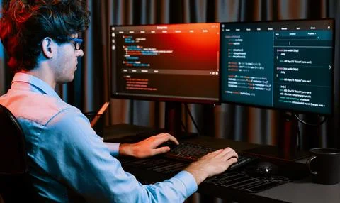 IT developer creating online software information coding on pc screen. Gusher. Stock Photos