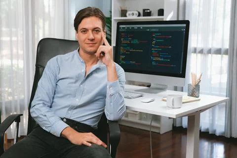 IT developer looking camera with online software development. Pecuniary. Stockfoto's