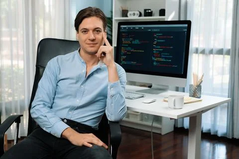IT developer looking camera with online software development. Pecuniary. Foto stock