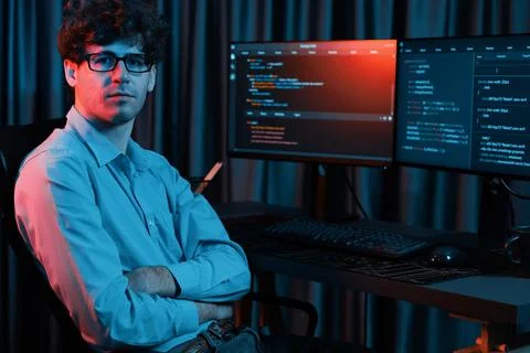 IT developer looking at camera with software development information. Gusher. 스톡 사진