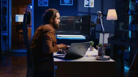 IT developer pressed by deadline, drinking coffee and doing multitasking Stock Photos