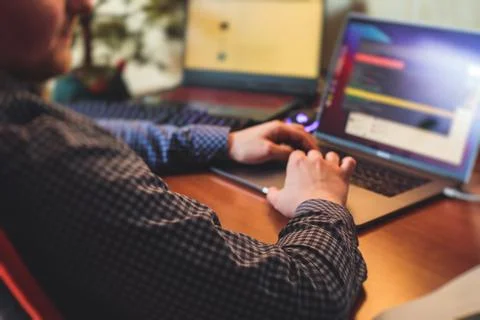 IT developer programmer working and coding on his worplace at home, laptop an 스톡 사진