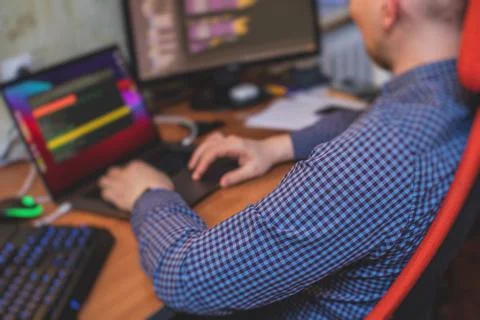 IT developer programmer working and coding on his worplace at home, laptop an 스톡 사진