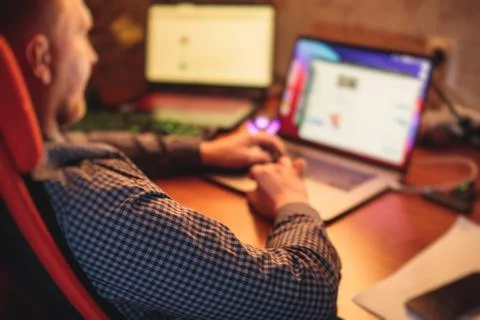 IT developer programmer working and coding on his worplace at home, laptop an Foto stock