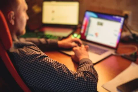 IT developer programmer working and coding on his worplace at home, laptop an Foto stock