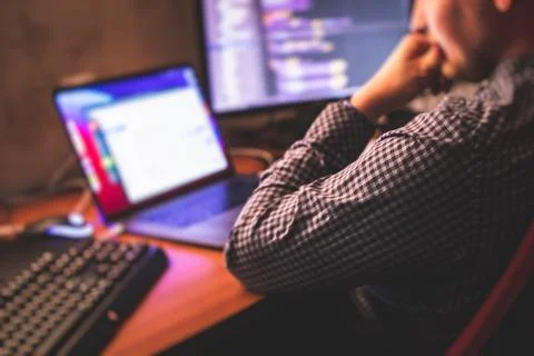 IT developer programmer working and coding on his worplace at home, laptop an 写真素材