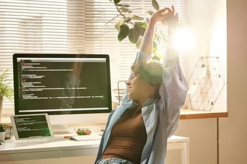 IT developer relaxing after work on computer Stock Photos